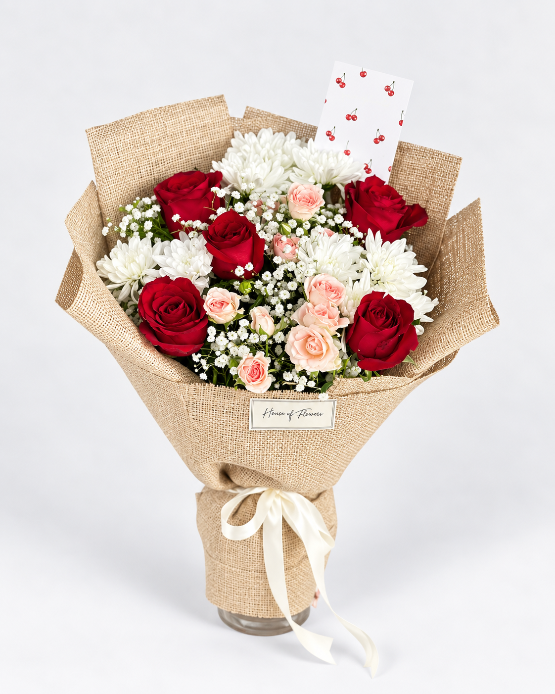 Cherry Blossom bouquet of red roses, peach spray roses and white chrysanthemums in burlap wrap