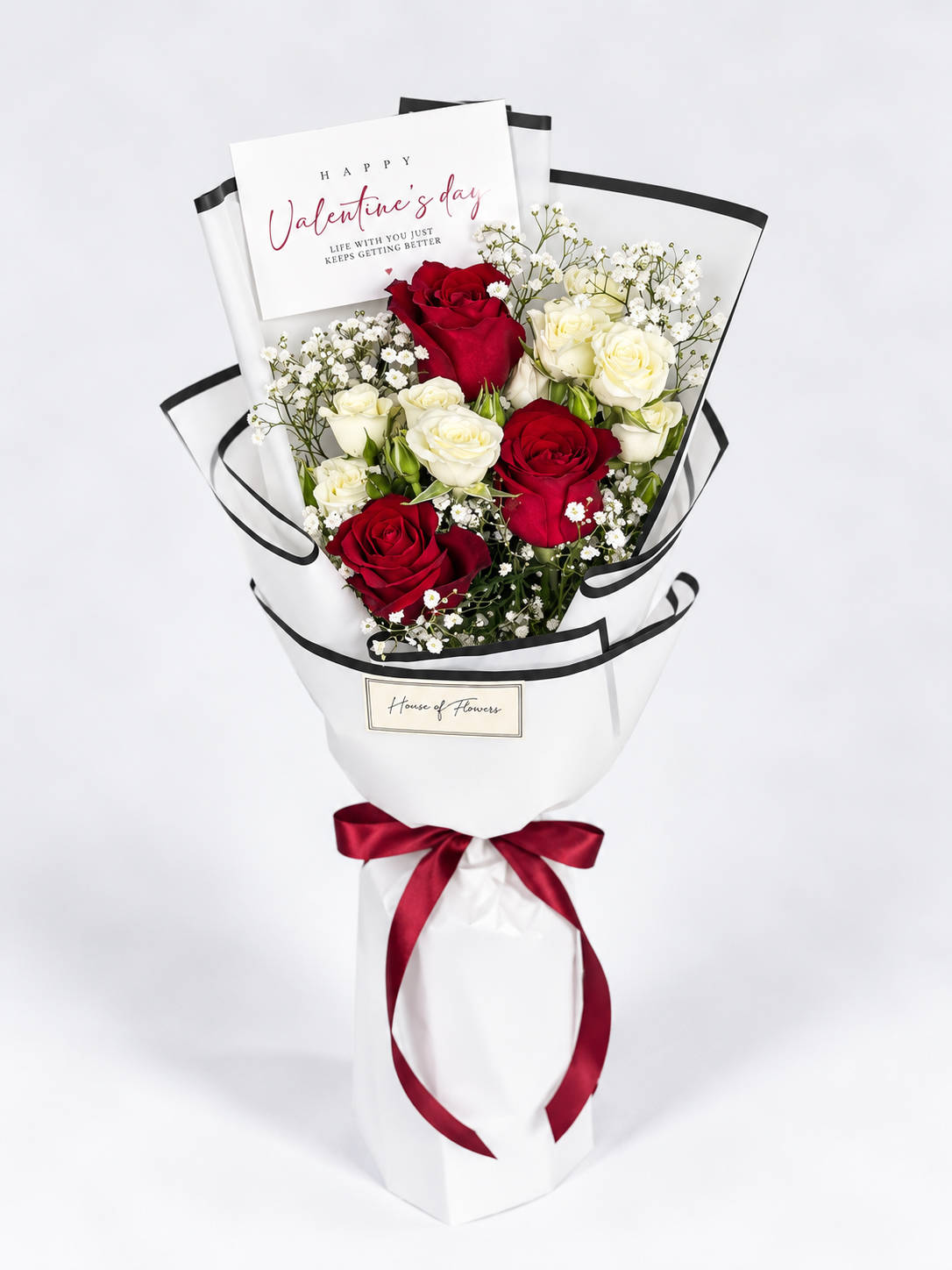bouquet with red roses and white spray roses.
