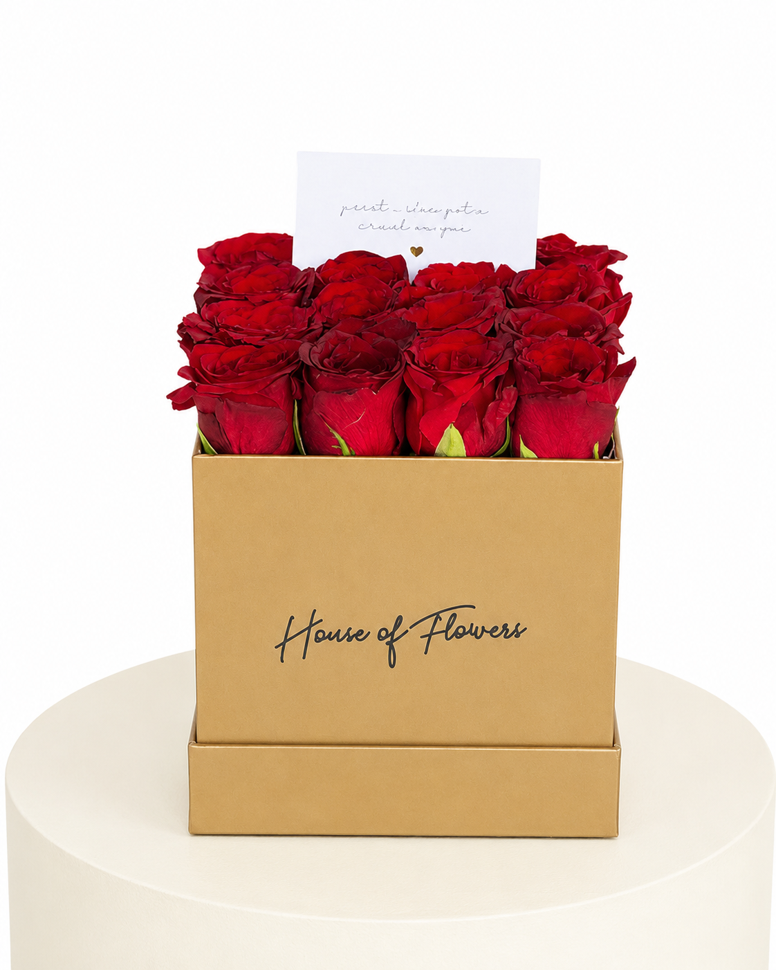 A gift box of 12 red roses in a square kraft paper box with &