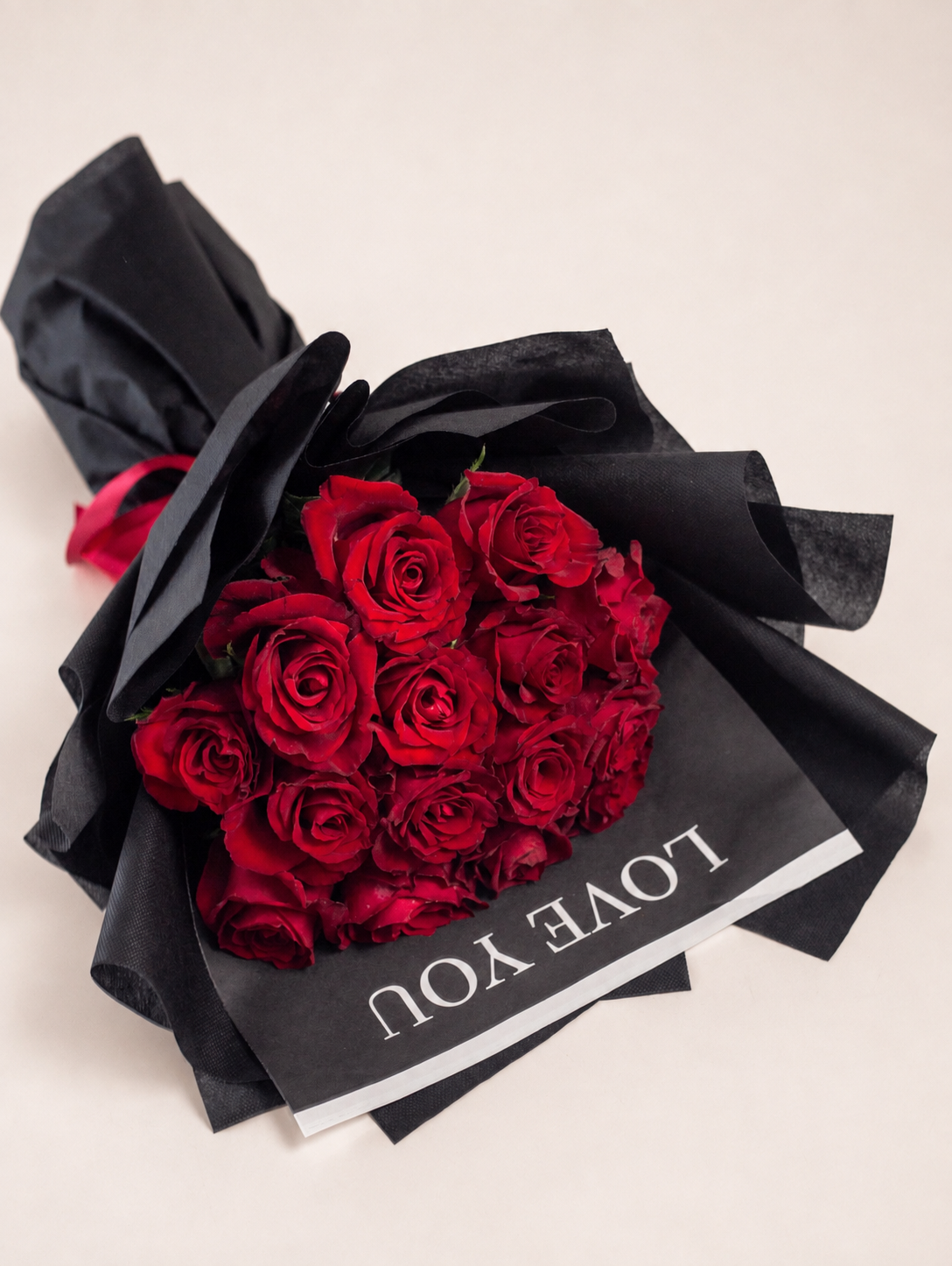 a bouquet of 15 imported red roses, wrapped beautifully in an imported wrapping sheet