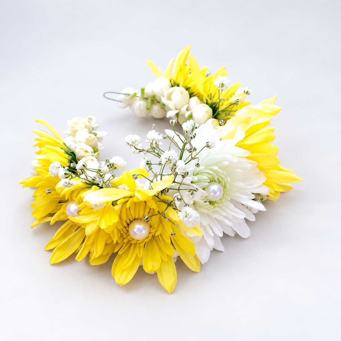 Flower bracelet of yellow and white chrysanthemums with pearl accents