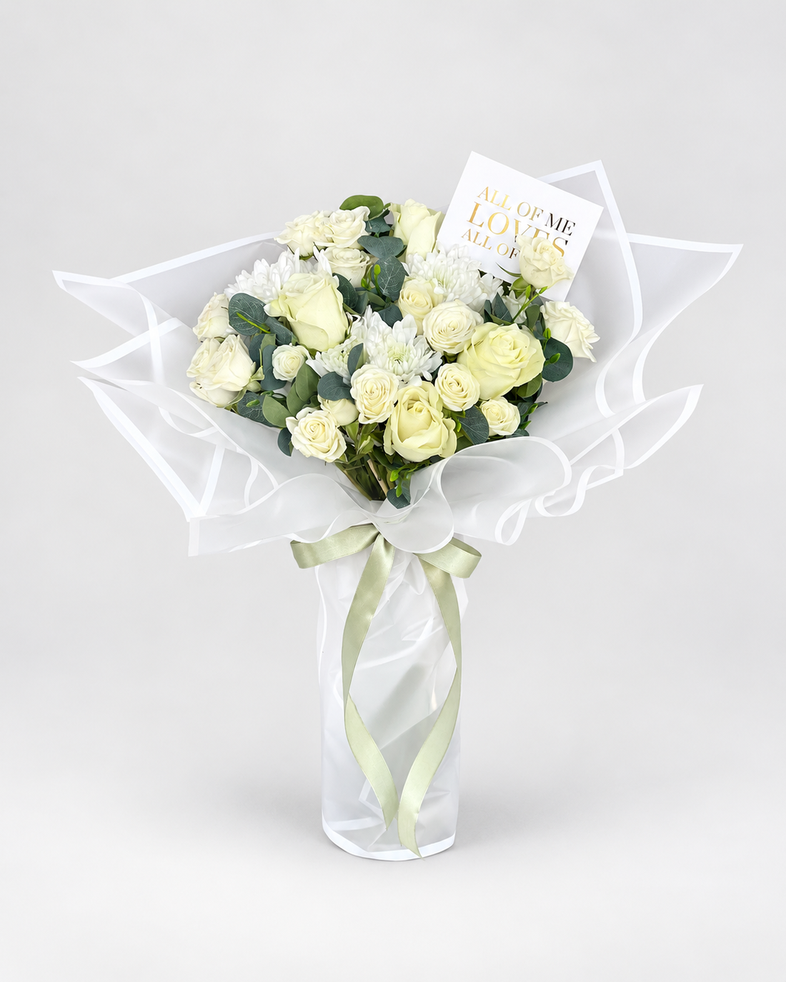 Ever After bouquet of white roses, spray roses and chrysanthemums with eucalyptus