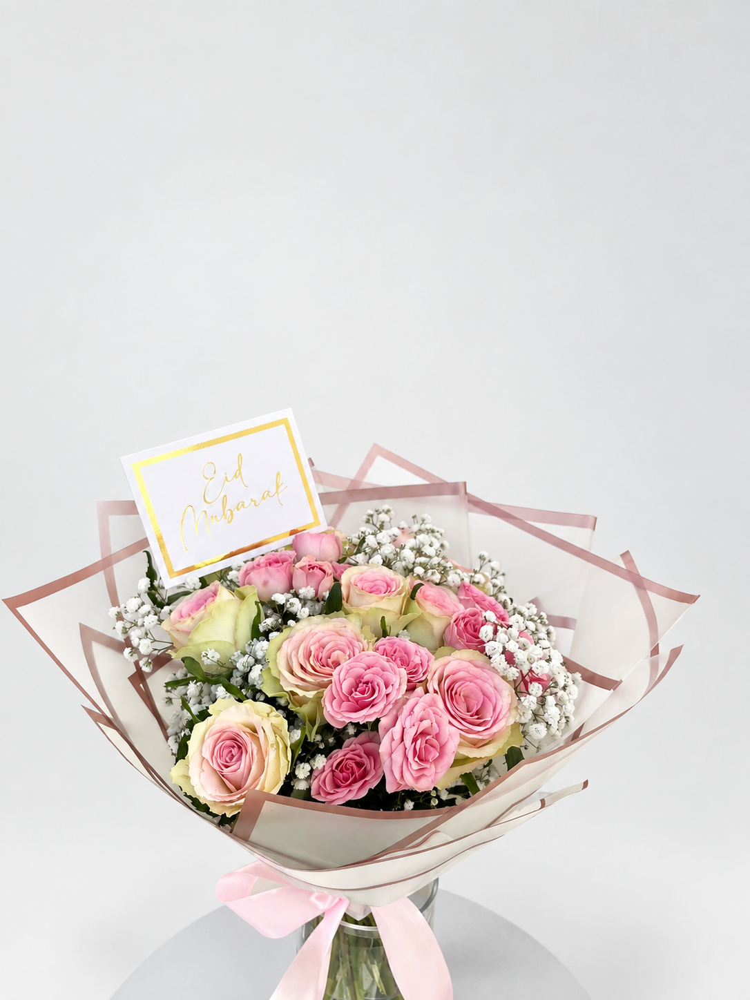 Pastel Sunset pink rose bouquet with a greeting card from House of Flowers