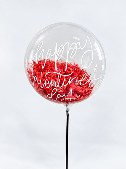 Clear balloon reading Happy Valentine&