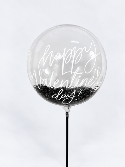 Clear balloon reading Happy Valentine&