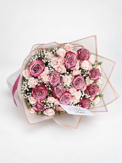 Close-up of the Lilac Dream bouquet with imported roses, spray roses, and baby&