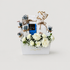 A curated gift basket arrangement in a white box with white roses, baby&