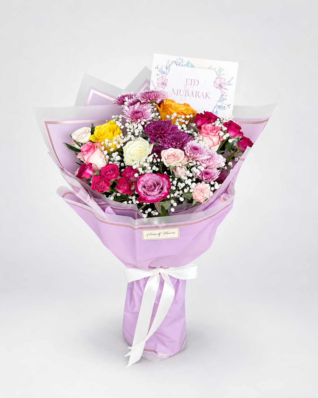 a vibrant flower bouquet with a mixture of different flowers like chrysanthemums, spray roses and roses.