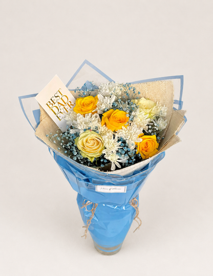 A  bouquet with roses, chrysanthemums and babys breath.