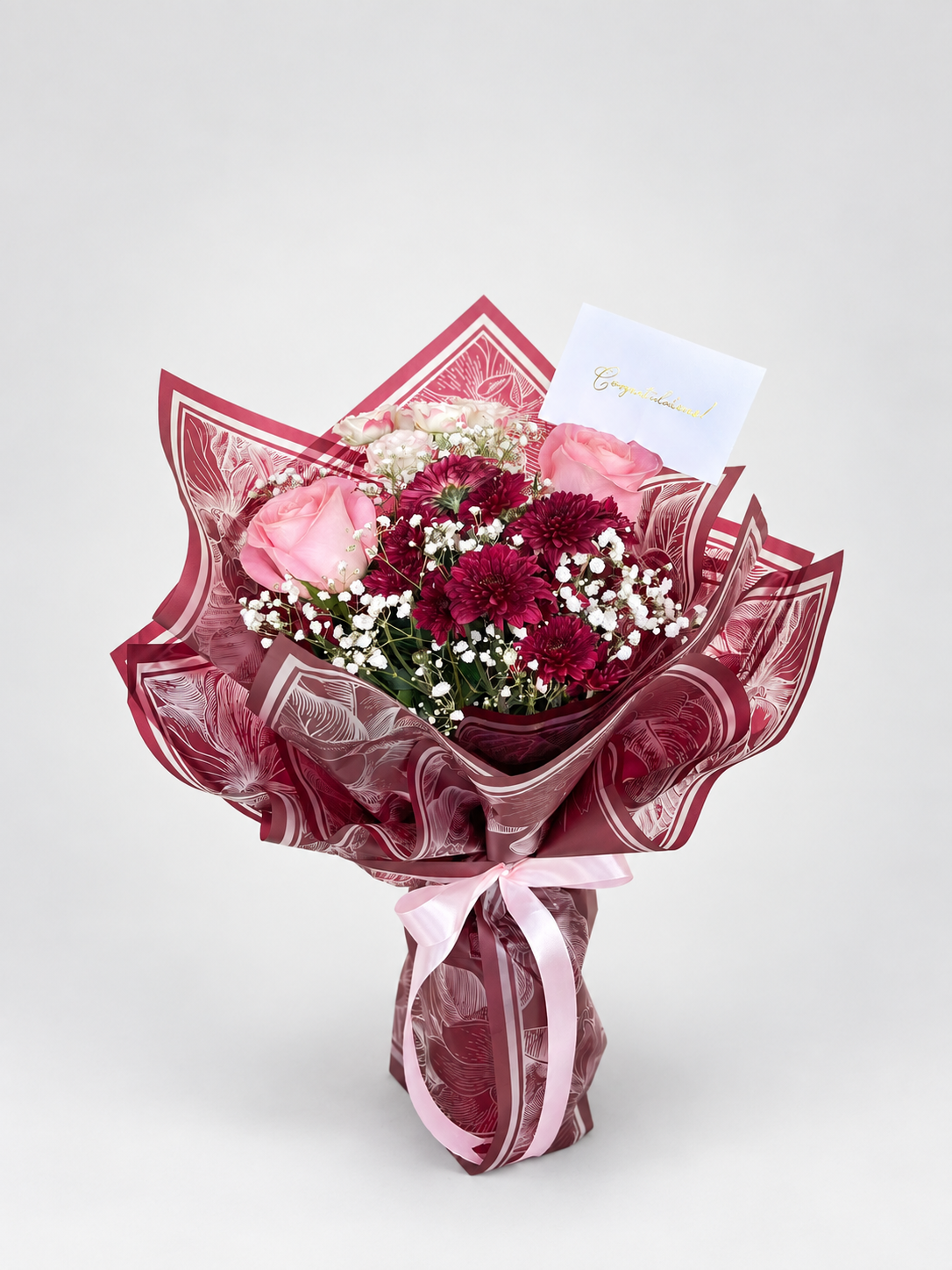 a cute bouquet with a mixture of roses and chrysanthemums wrapped in a premium wrapping sheet.