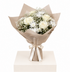 A bouquet of white roses, white chrysanthemums, and baby&