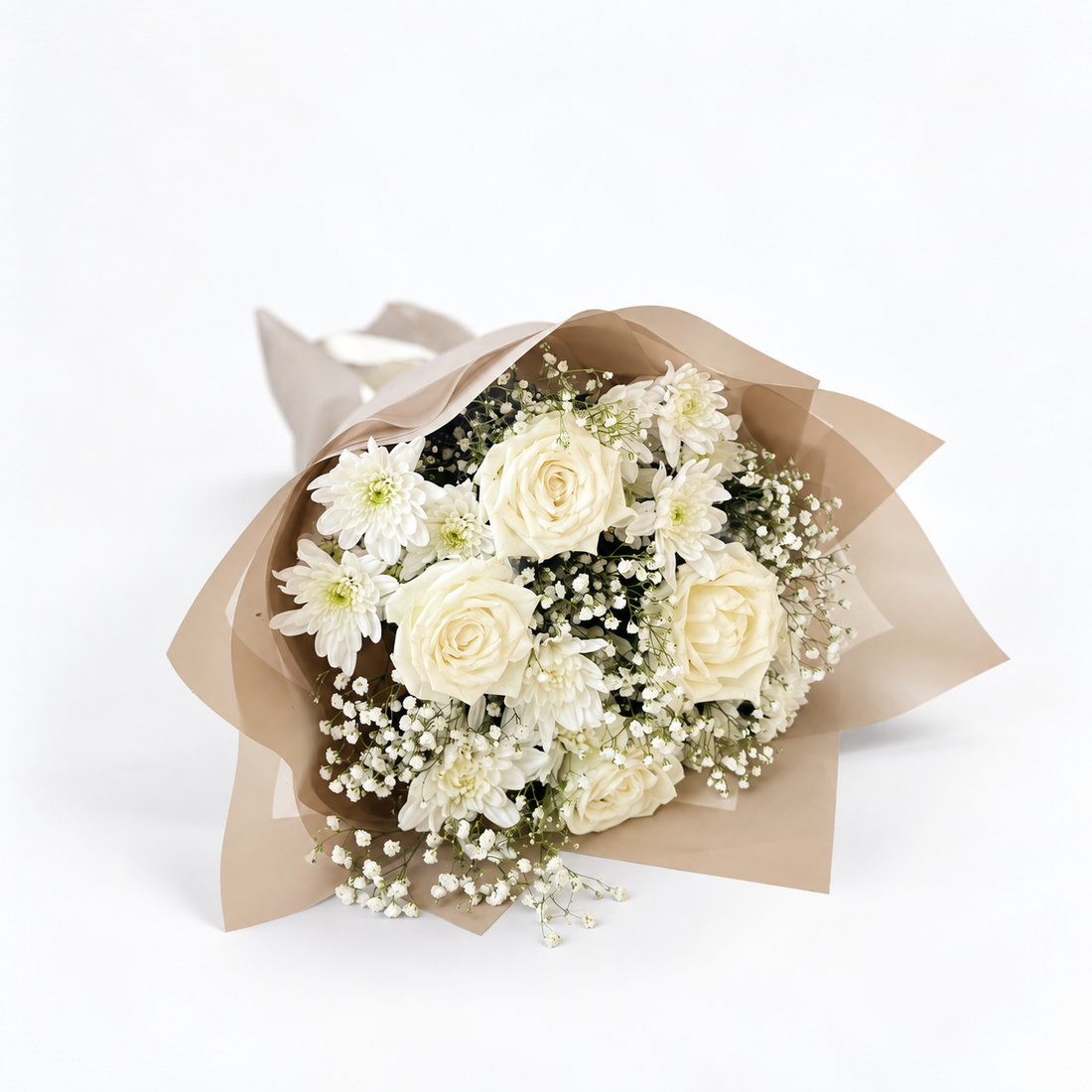 A bouquet of white roses, white chrysanthemums, and baby&