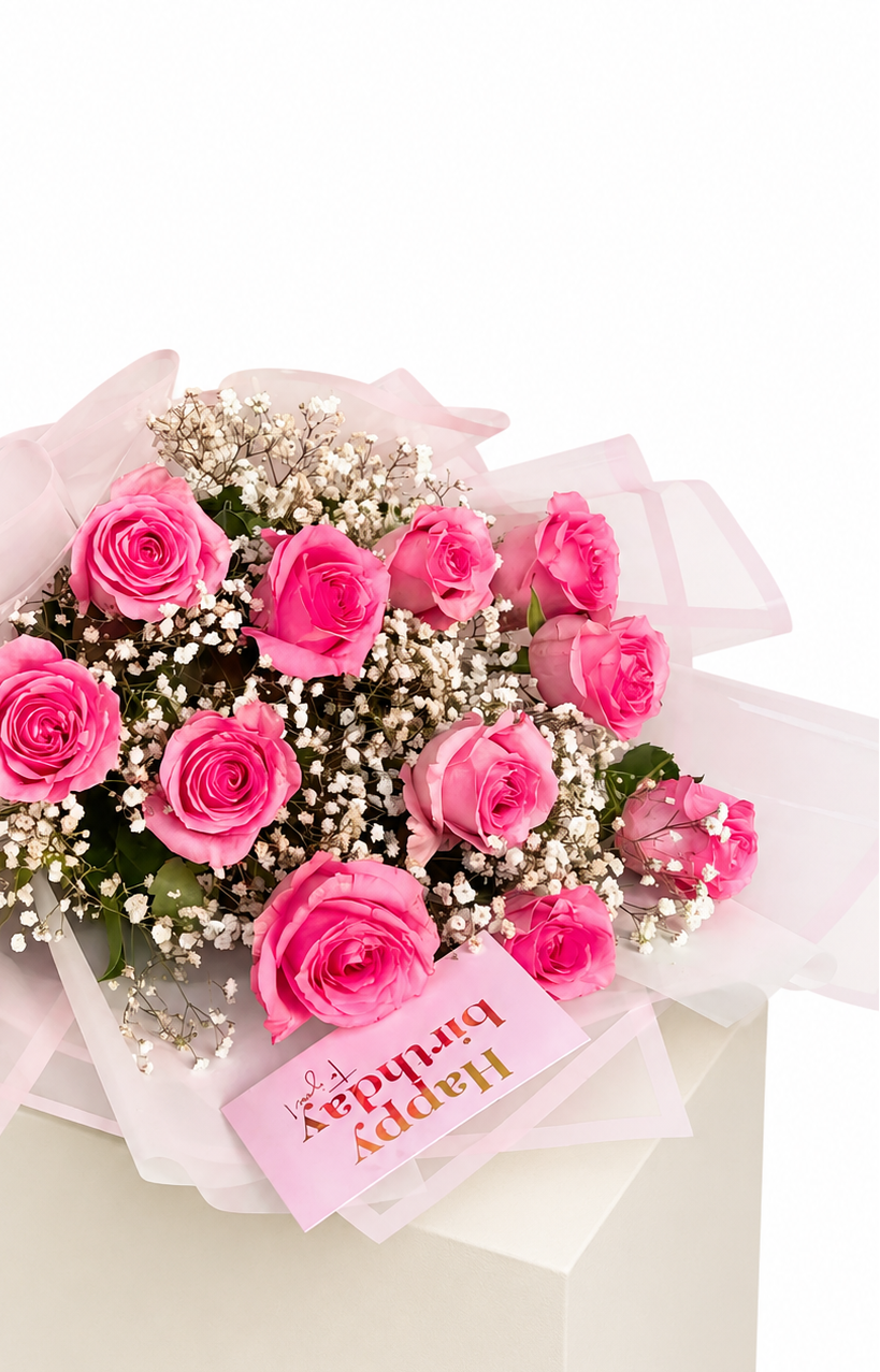 A bouquet of pink roses and white baby&