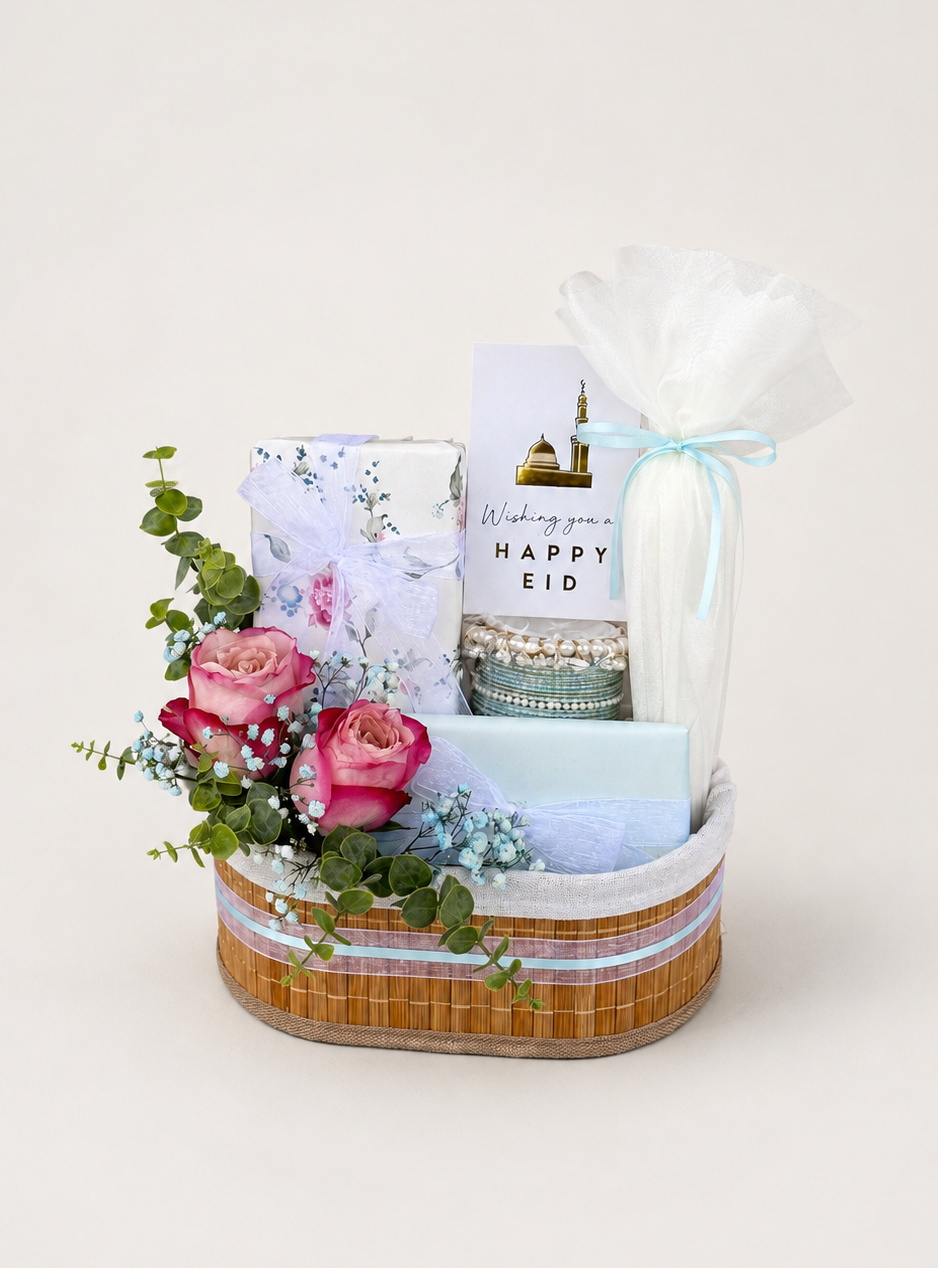Garden blush gift basket with pink roses and Happy Eid card arrangements.