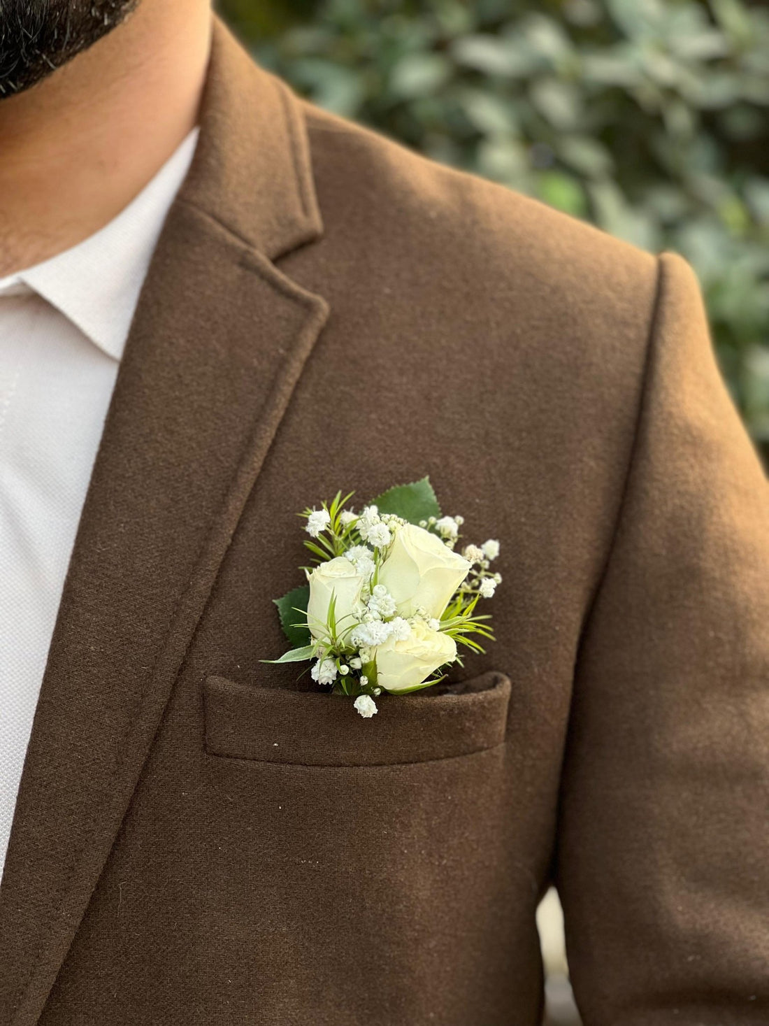 Fresh flower boutonniere from House of Flowers, made for weddings and formal events
