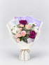 A bouquet  of maroon chrysanthemums, white chrysanthemums , roses and spray roses.