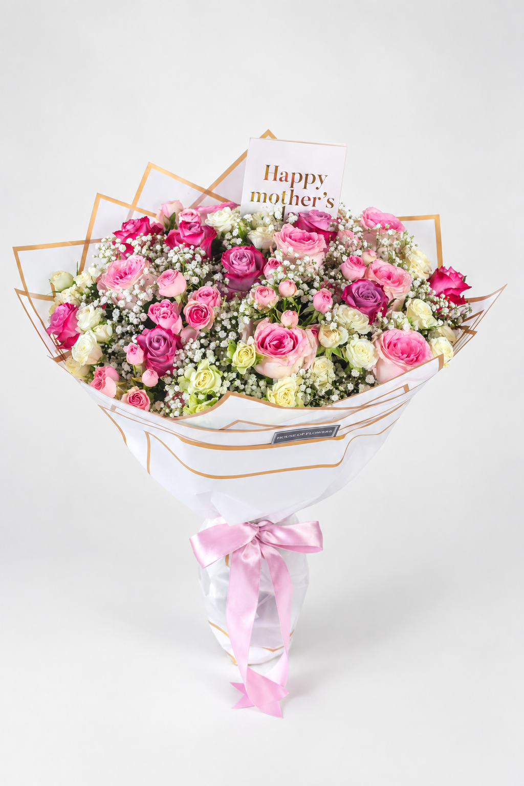 Enchanted Meadows bouquet of 17 roses and 13 spray roses in pink, purple and white with gypsophila