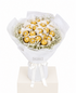 A gift bouquet made of assorted Ferrero Rocher chocolates wrapped in white tissue paper and a white paper sleeve, tied with a white ribbon.