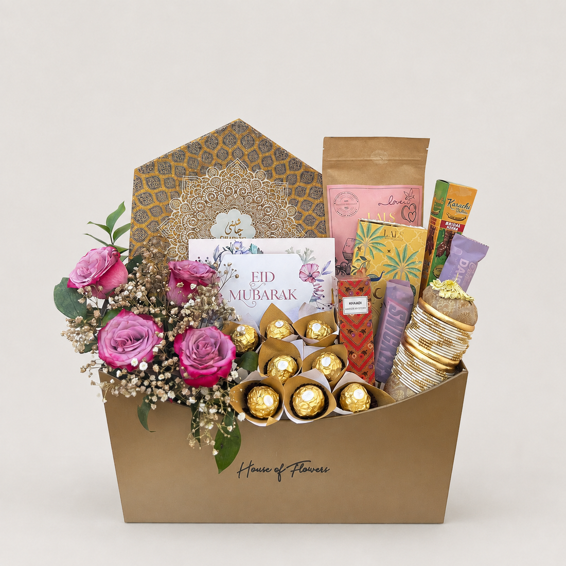 this basket is ideal for eid . it contains different chocolates,  bangles and mithai.