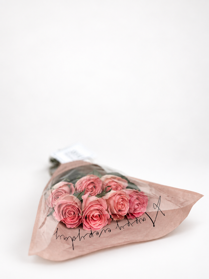 A bouquet of 7 roses and exquisite wrapping.