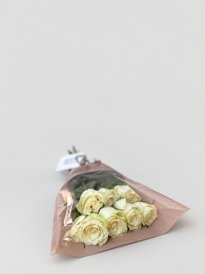 A bouquet of 7 roses and exquisite wrapping.