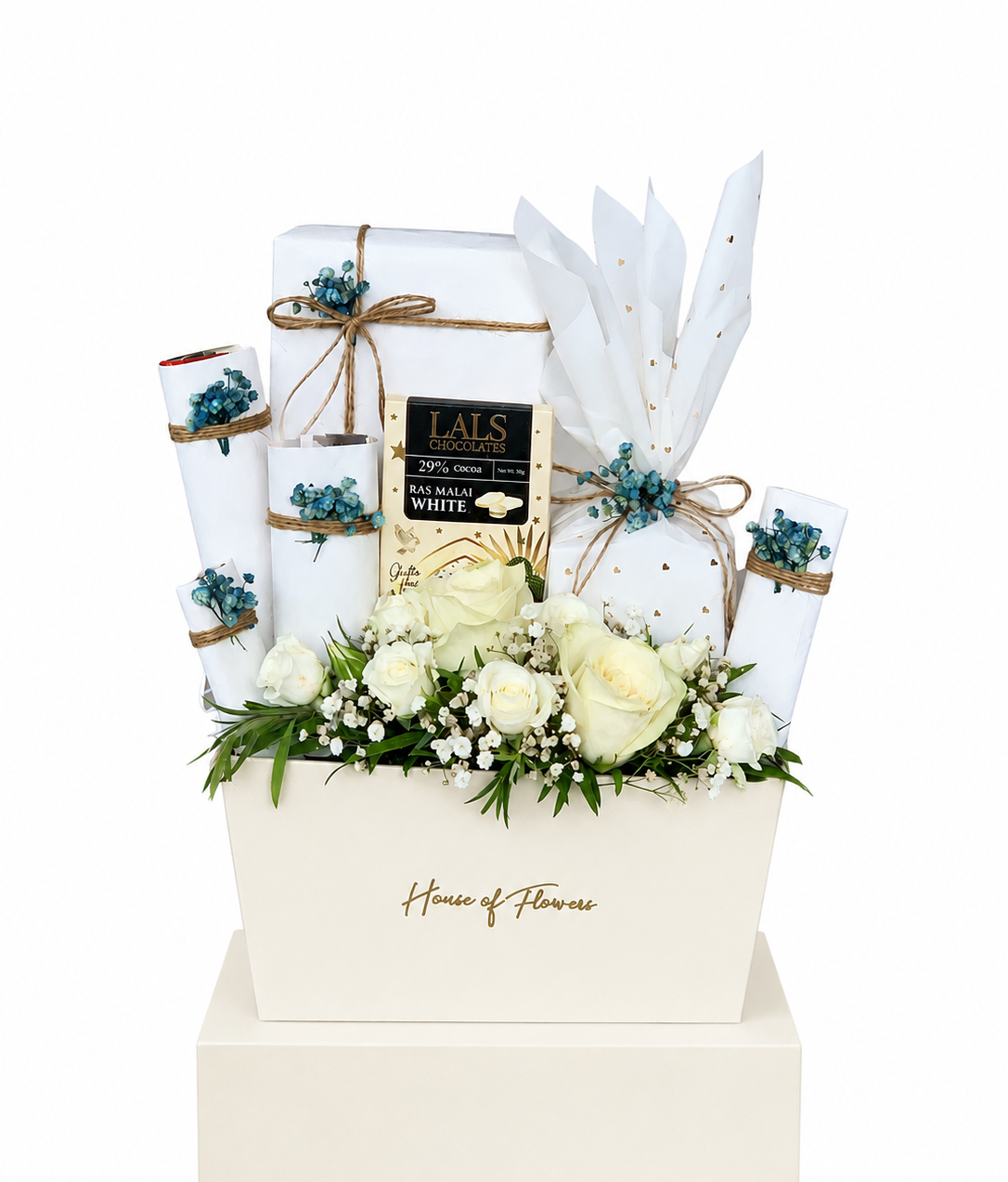 a box with a mixture of imported chocolates, danisa cookies and a candle