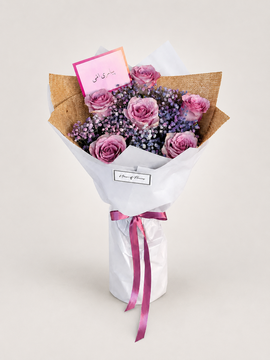 A bouquet of pink roses and purple baby&