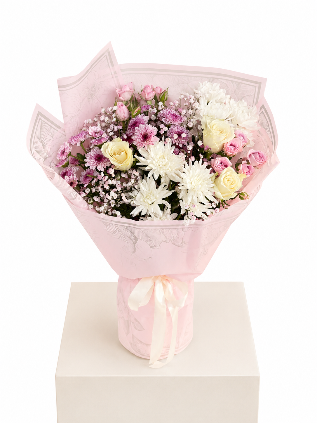 a bouquet of 3 roses, 3 spray roses, 4 chrysanthemums and 1 babys breath wrapped in a premium wrapping sheet.