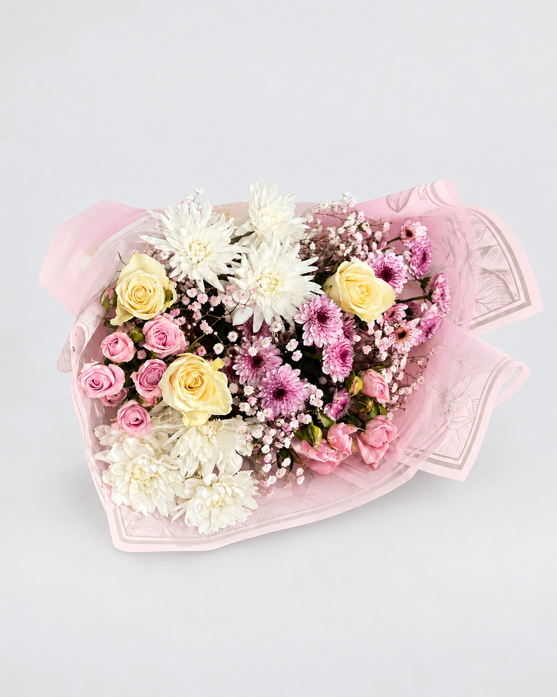 a bouquet of 3 roses, 3 spray roses, 4 chrysanthemums and 1 babys breath wrapped in a premium wrapping sheet.