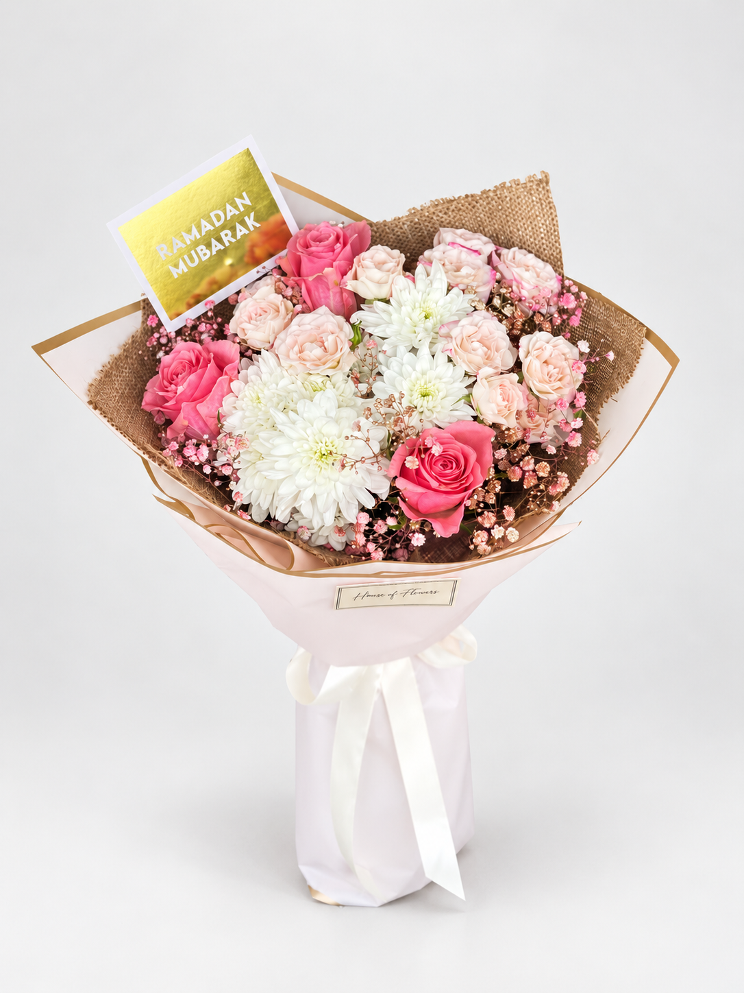 A bouquet  of  white chrysanthemums , roses and spray roses.