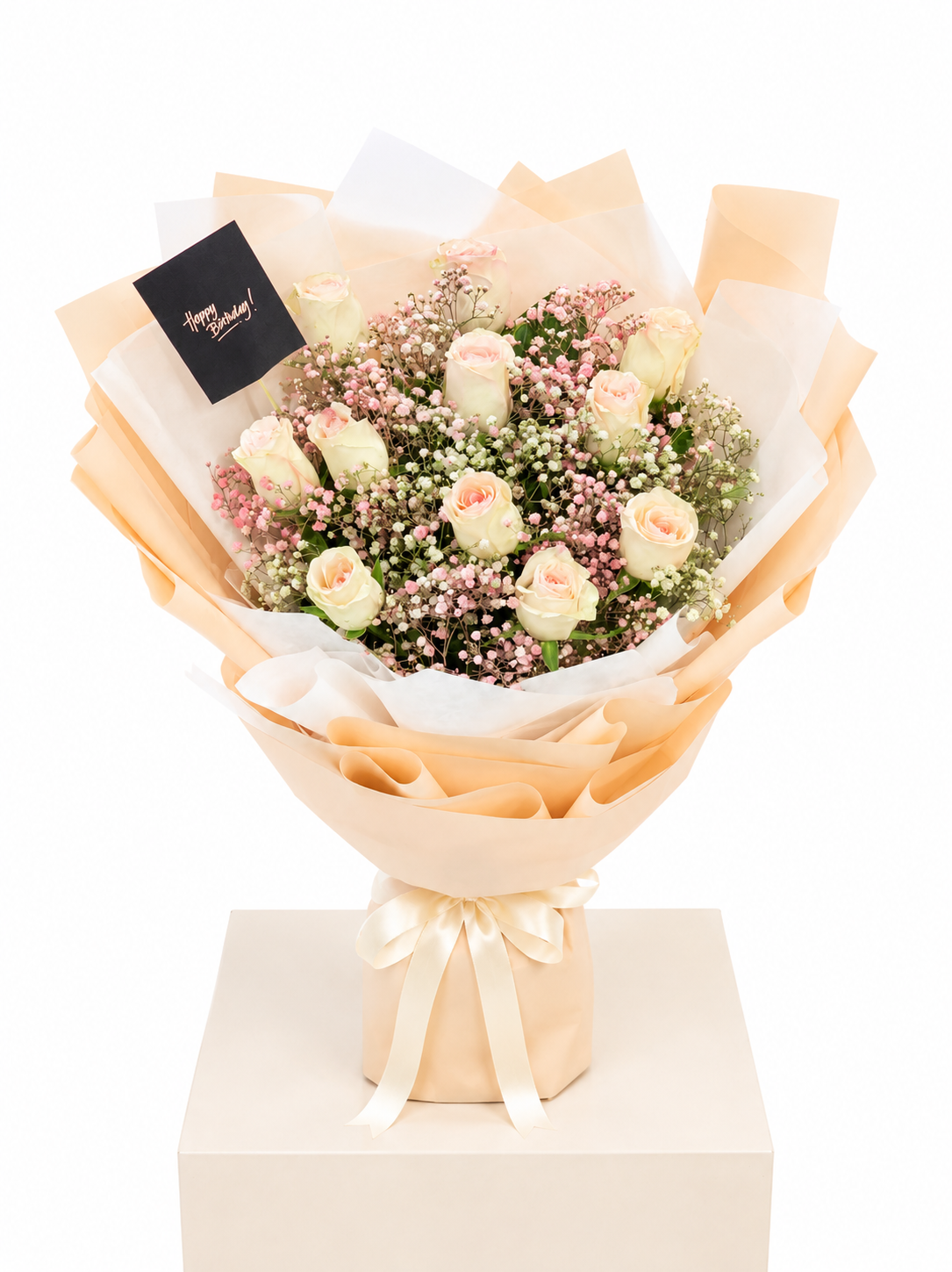 A floral bouquet with peach and cream roses, pink baby&