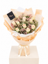 A floral bouquet with peach and cream roses, pink baby&