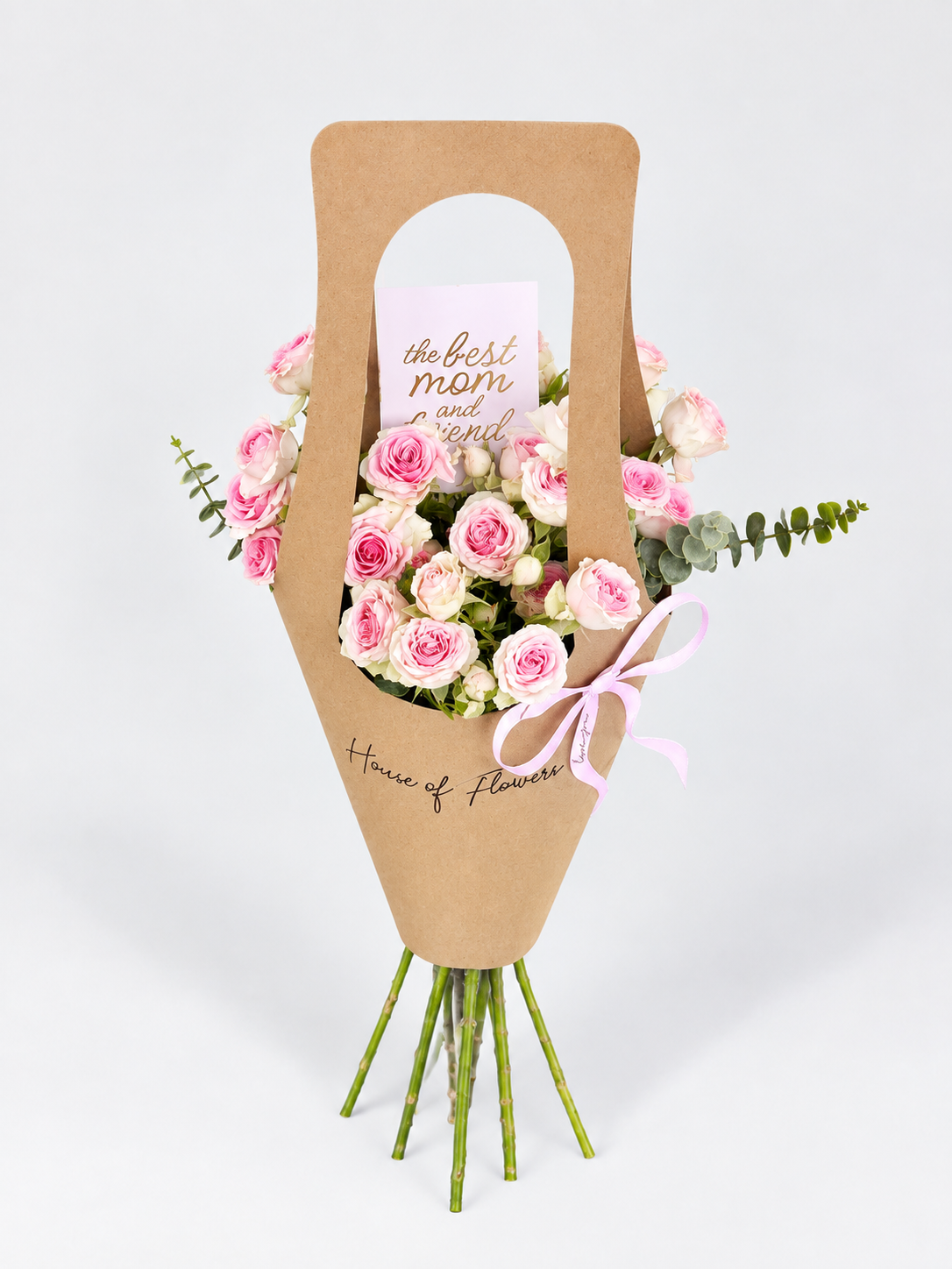 Purely for Her bouquet with pink roses in a kraft paper carrier bag with a "The Best Mom" card and pink ribbon