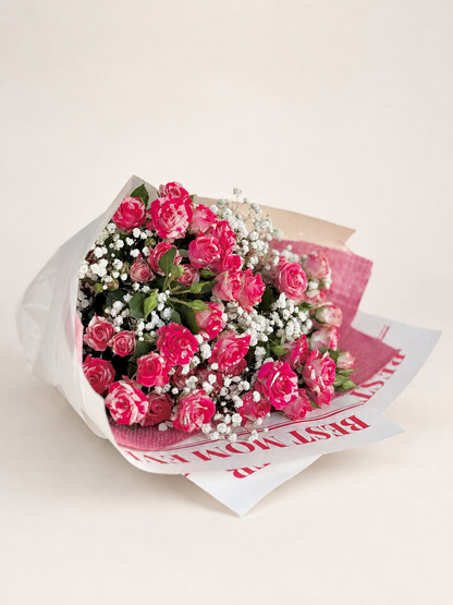 A bouquet of pink roses and white baby&