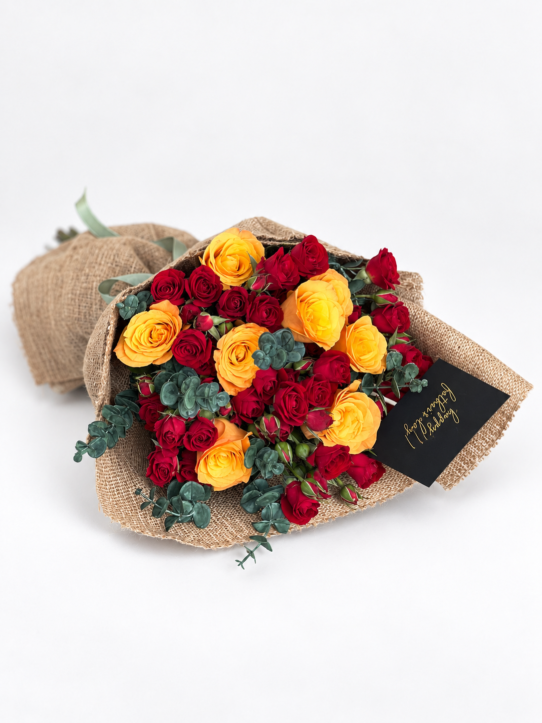 Bouquet of red and yellow roses with a &