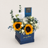 Shine on Dad gift box featuring two sunflowers, two spray roses, gypso, artificial fillers, a Lals chocolate bar, candle jar, and greeting card.