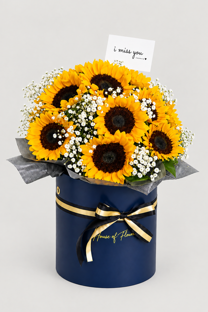 A bouquet of sunflowers and white baby&