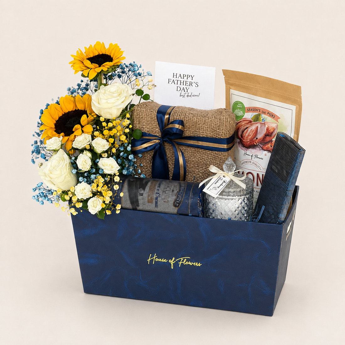 Sunlight &amp; Strength gift box with sunflowers, roses, gypso, almonds, cookies, chocolate, a candle, wafers, and greeting card.