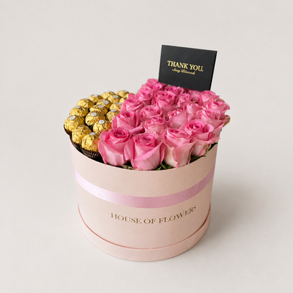 Sweet Affairs arrangement of revival pink roses paired with Ferrero chocolates