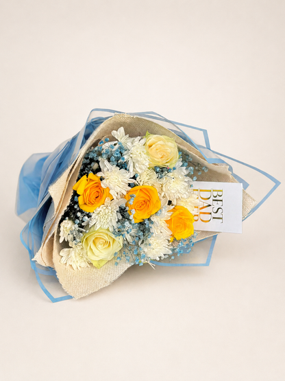 a bouquet with a mixture of flowers. roses, chrysanthmums, babys breath.