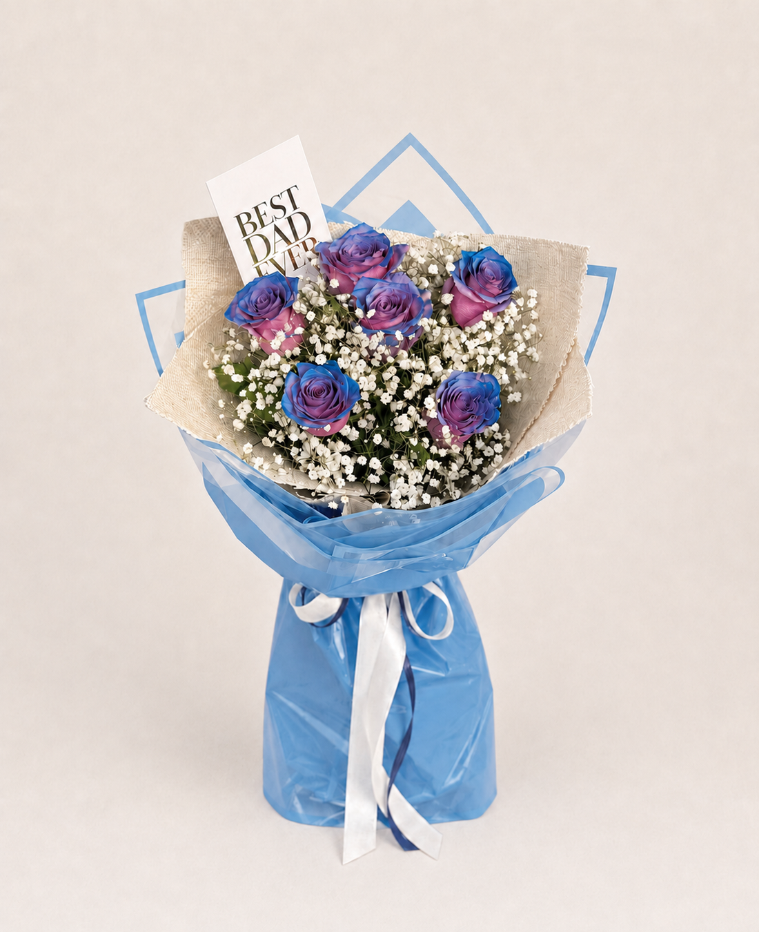 The Protector blue and purple rose bouquet with baby’s breath and a greeting car