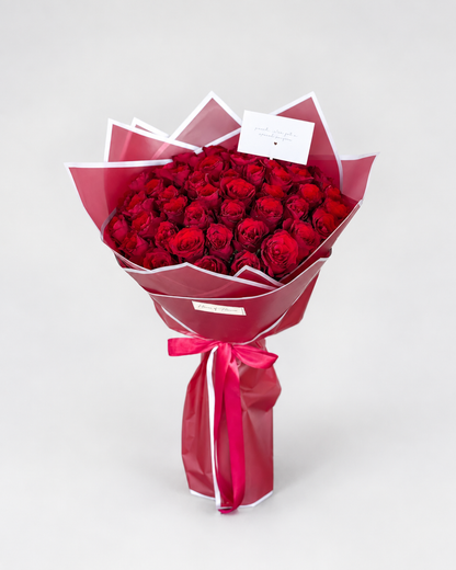 Timeless Fifty bouquet of 50 imported red roses with a greeting card from House of Flowers