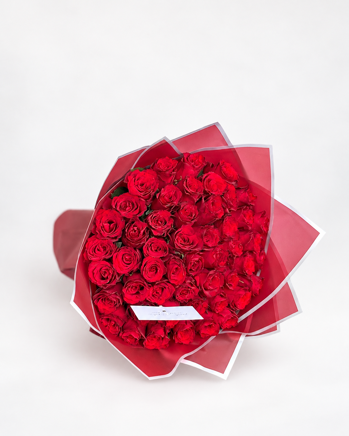 Timeless Fifty bouquet of 50 imported red roses with a greeting card from House of Flowers