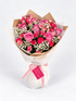 Timeless Tribute bouquet with pink and hot pink roses and gypsophila, wrapped in kraft and white paper with a pink ribbon and card
