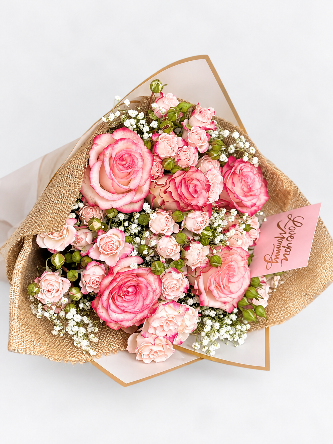 With all my Heart bouquet with pink roses and gypsophila, wrapped in kraft and white paper with a "Love You Mommy" card